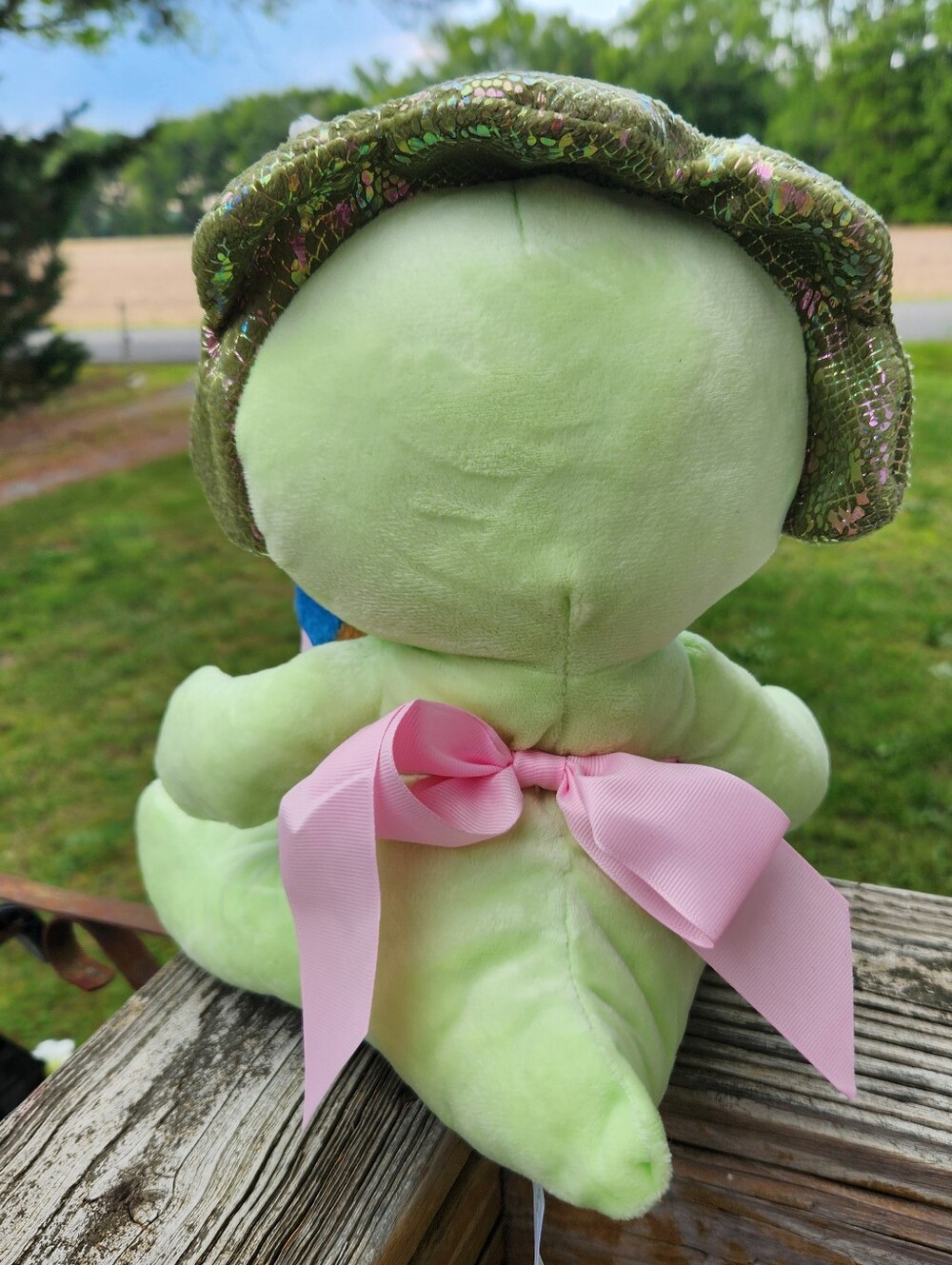 Plush Green Triceratops Holding Blue Patterned Throw - Picture 3 of 6